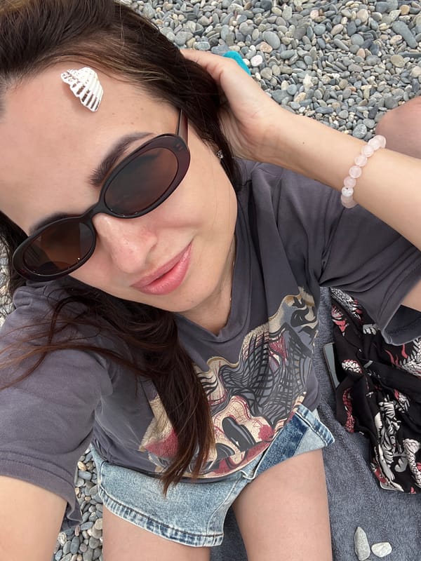 Beach day selfies and relaxation on pebble shore