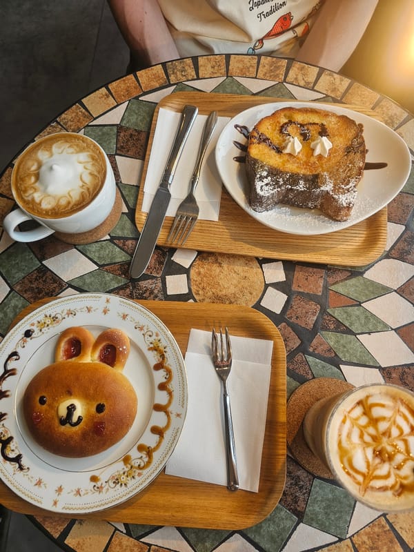 Early morning cafe visit documented in Kyoto with costumed dog