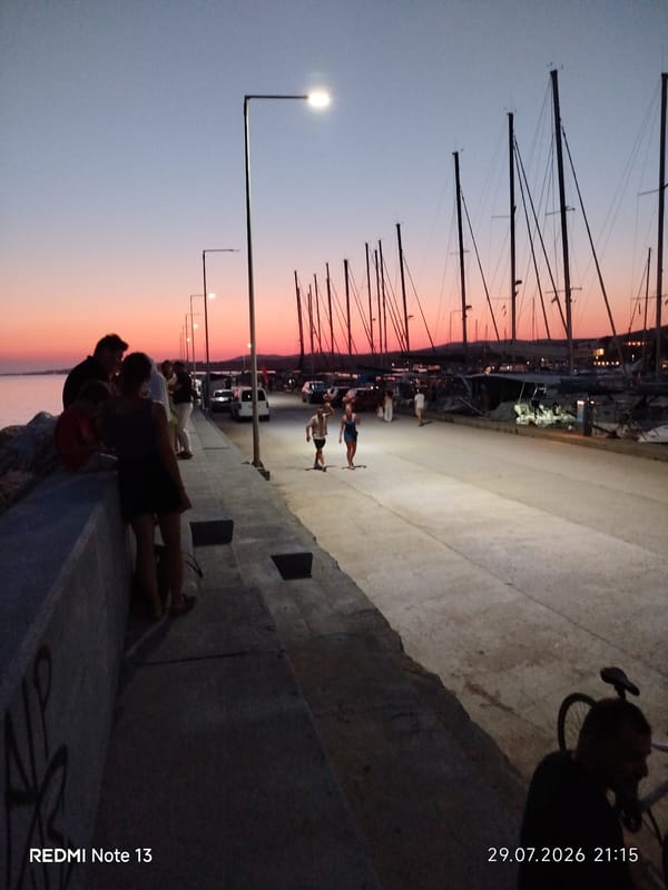 Sunset to moonrise at a Sithonia harbor promenade