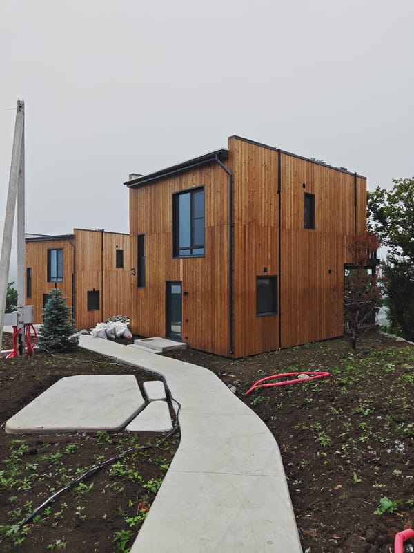 Modern wooden housing complex on a misty Vladivostok hillside