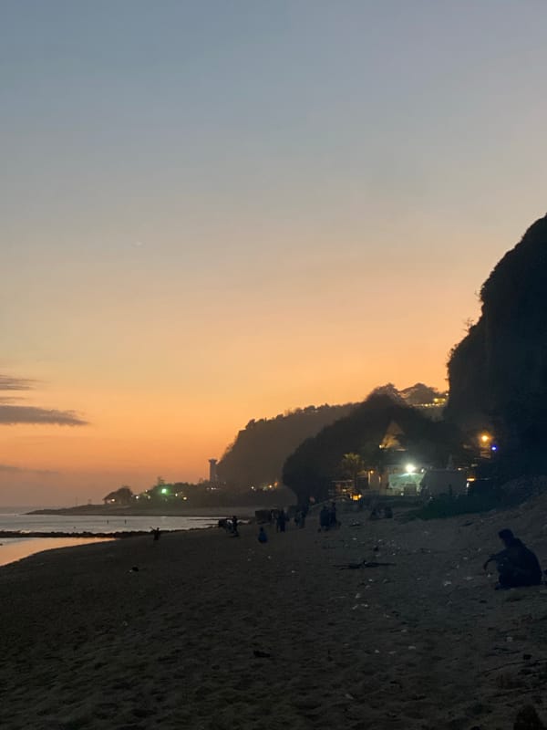 Birthday beach gathering in Kuta Selatan with food, ocean, and festivities