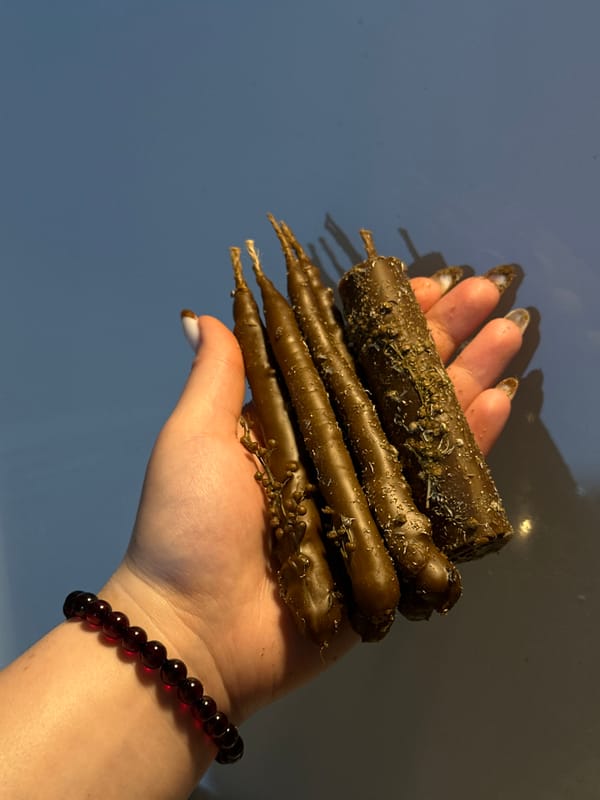 Woman displays homemade chocolate pastries in Russian neighborhood