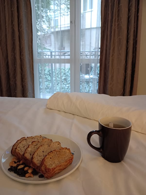 Banana bread breakfast laid out on a bed in Sofia