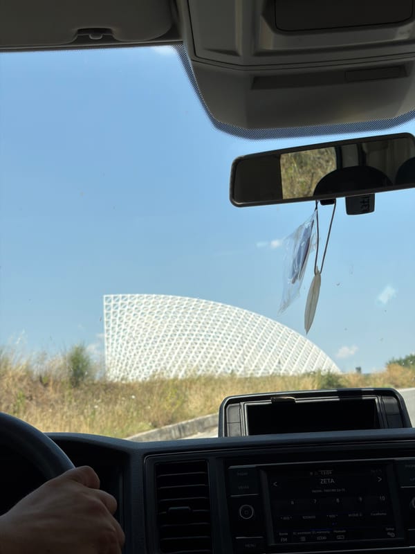 Road trip passing through a large outdoor event site