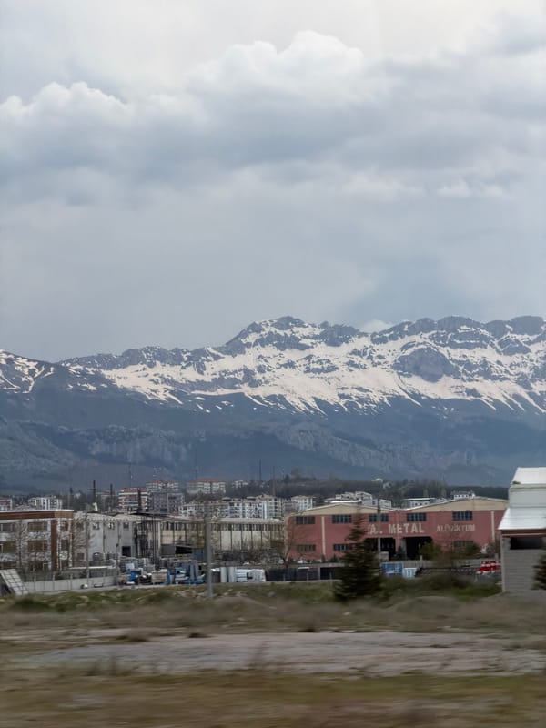 Snow-capped mountains photographed under overcast skies in Seydişehir, Turkey