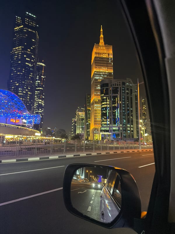 Doha skyscrapers display colorful light shows during evening hours