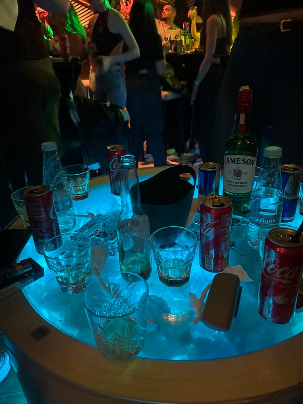 Neon-lit drinking table documented in Veliko Tarnovo nightlife scene