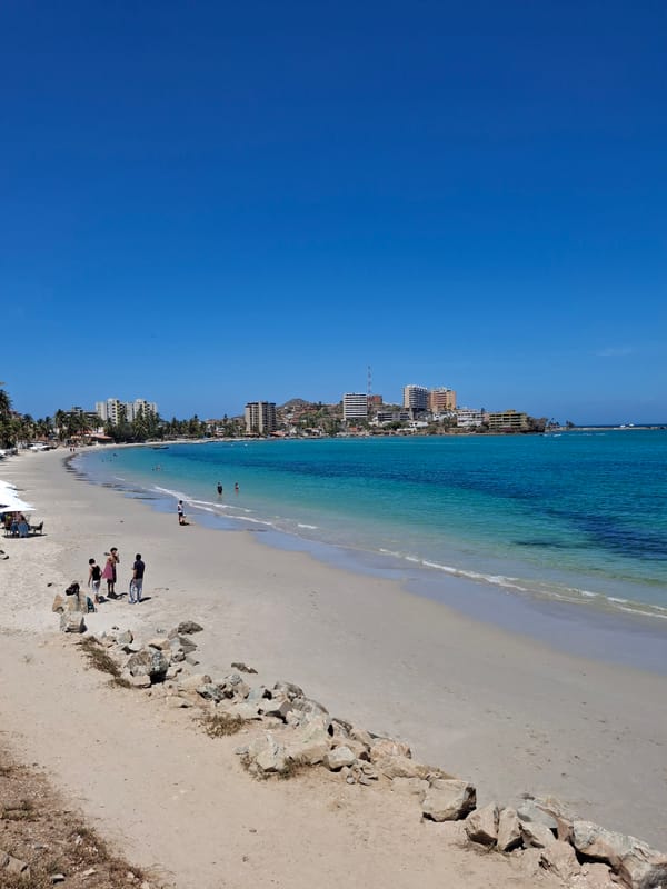 Beachgoers enjoy sunny afternoon at Pampatar, Venezuela coastline