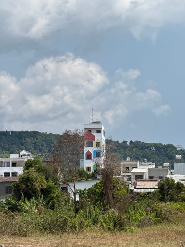 Colorful-windowed white building observed in Phú Quốc, Vietnam