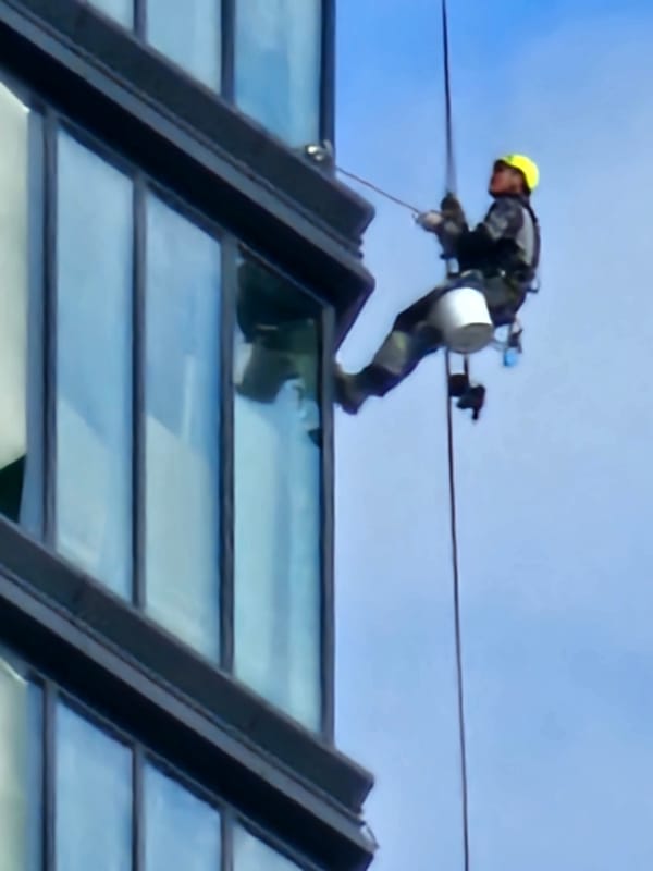 High-rise maintenance crews at work across Moscow buildings