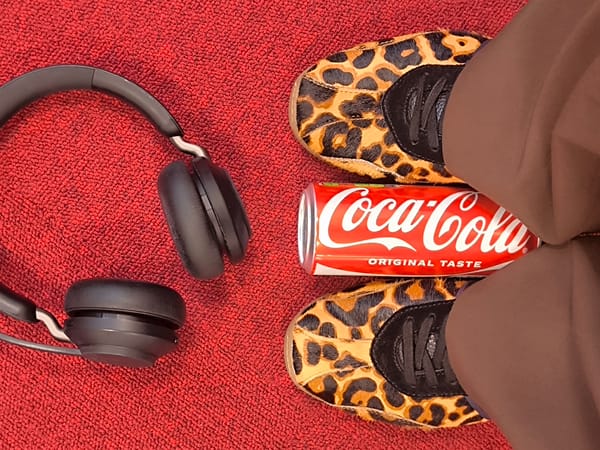 Riga resident documents casual desk snack moment with headphones