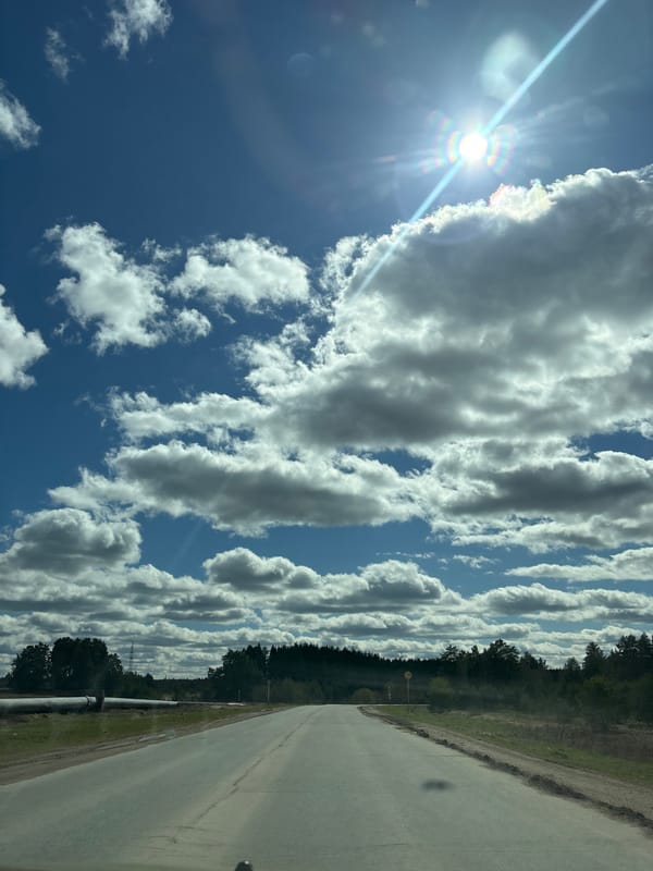 Clear skies documented along rural road in Прикамский, Russia
