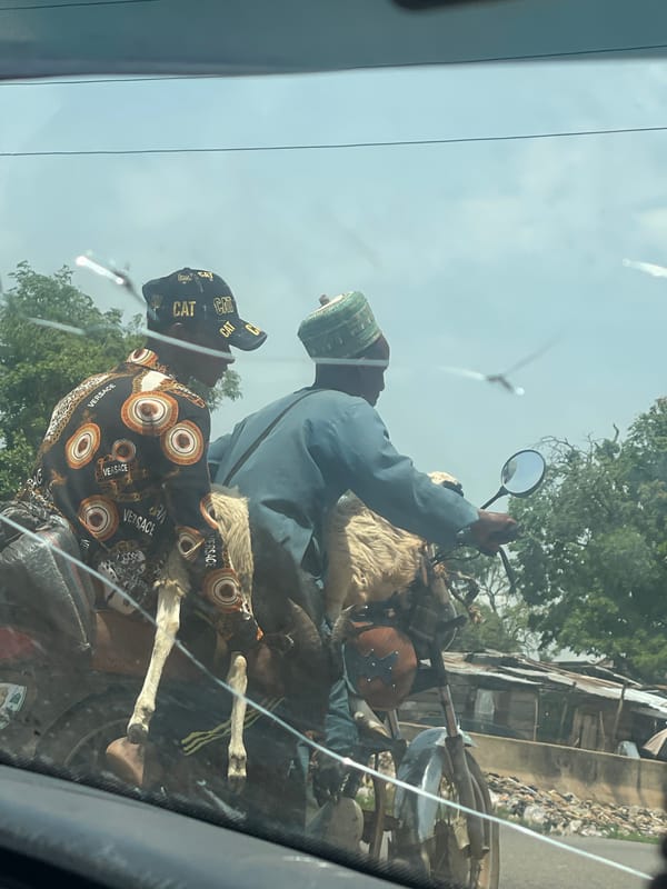 Truck tire repair draws crowd in Kwali, Nigeria