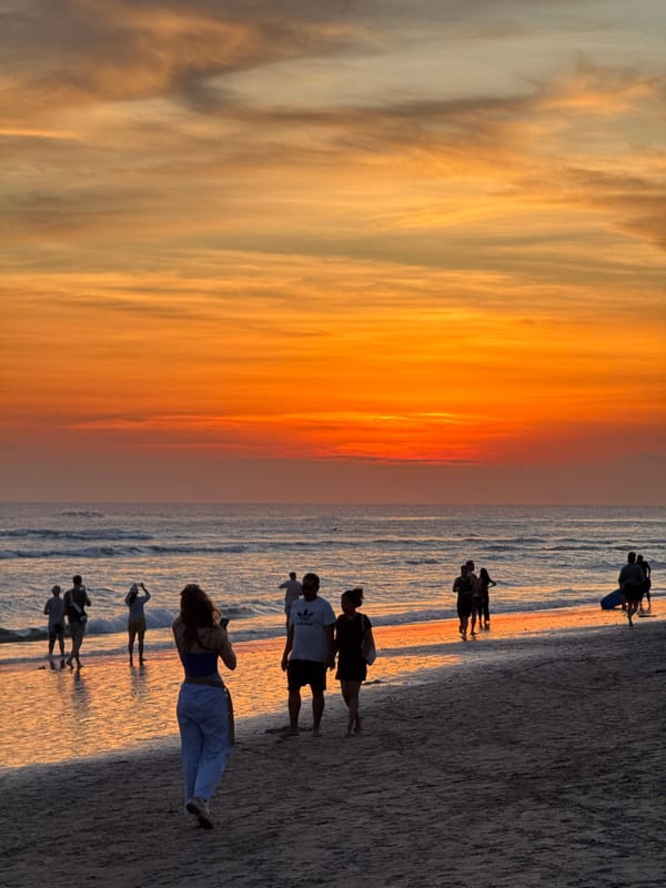Beachgoers enjoy sunset activities in North Kuta, Indonesia