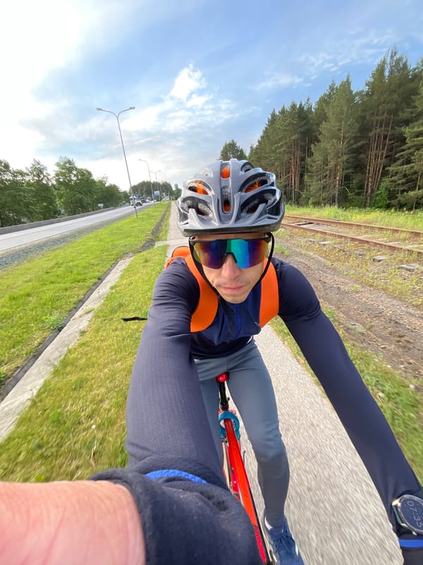 Early morning cyclist rides abandoned railway path in Chaikovsky