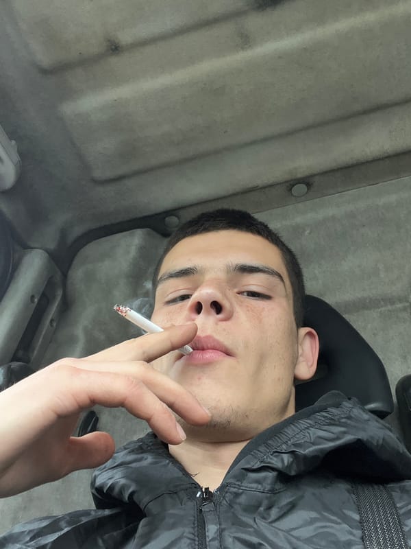 Young man photographed smoking cigarette in Sopot, Bulgaria