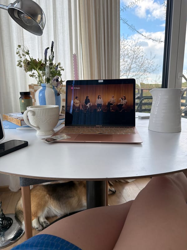 Person in blue shorts sits by window in Gangloff