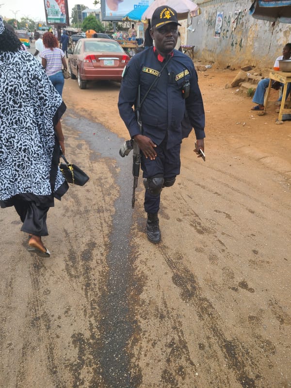 Street activity including armed police presence observed in Jos