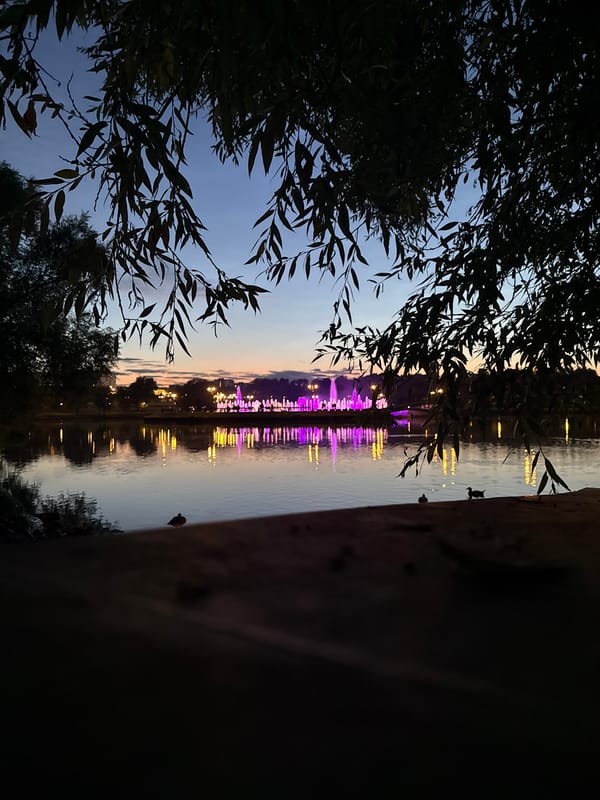 Tsaritsyno estate at twilight: bridge, waterfront, and church