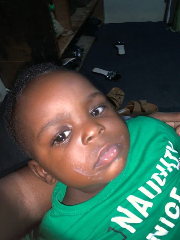 Baby in a green shirt, everyday moments at home