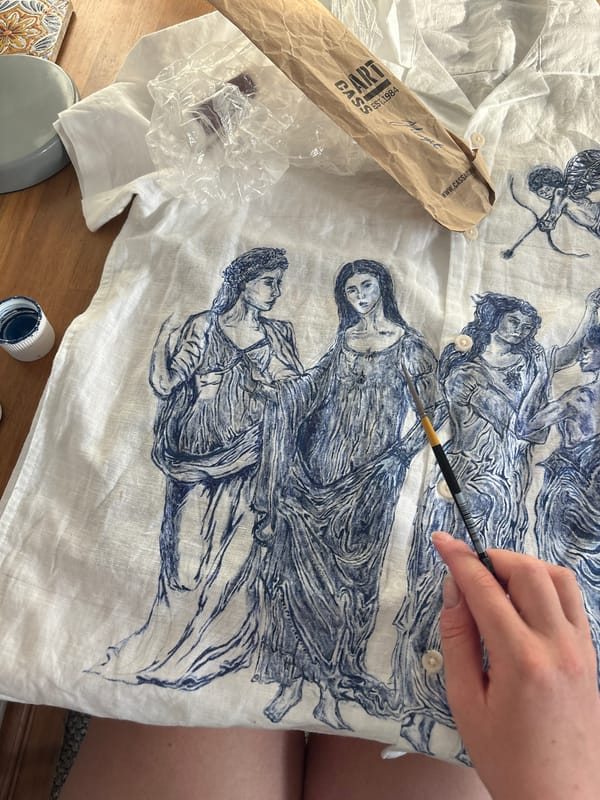 Artist works with fine brush in Manchester studio