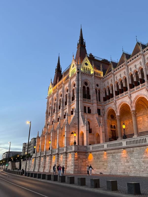 Witness documents Budapest Parliament at dusk during 10-minute riverside walk