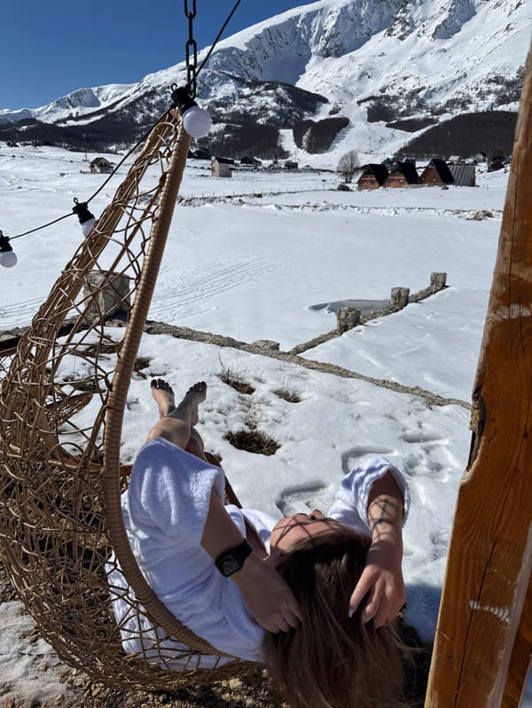Woman documents winter retreat with dog in Montenegro mountains