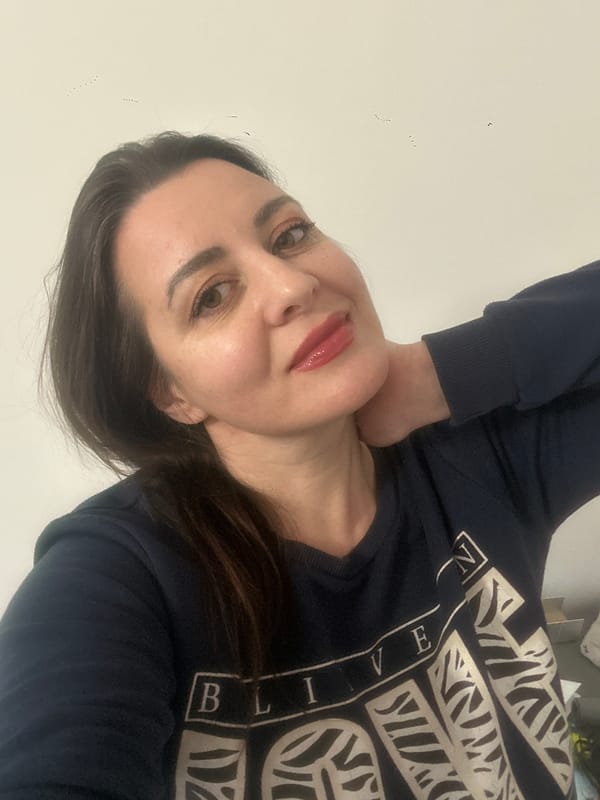 Woman photographed twice in Riga wearing 'BELIEVE' shirt