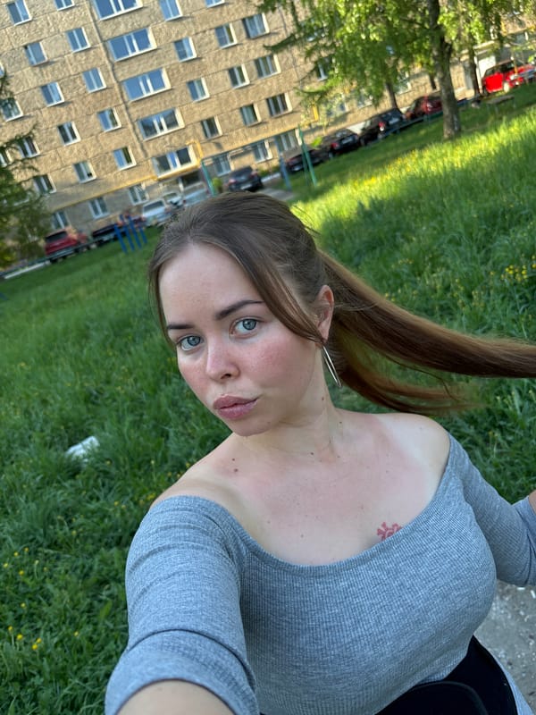 Woman photographed with dachshund in Izhevsk park setting