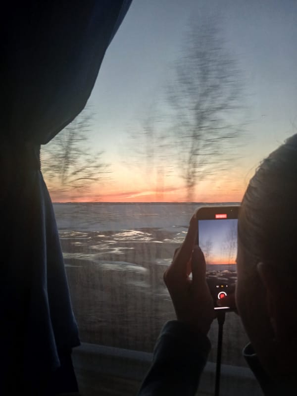 Person Films Winter Sunset on Smartphone in Kryukovo
