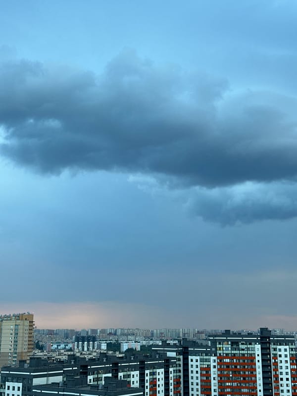 Stormy evening sky settles over a dense Russian cityscape