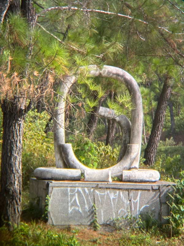 Exploring an abandoned sculpture park by a lake in Huế