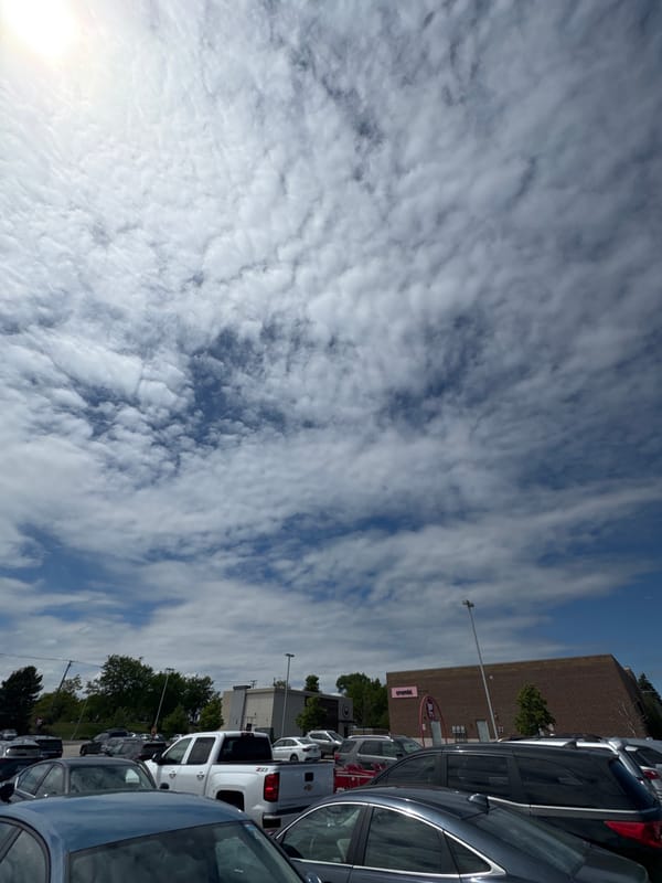 Cloudy evening parking lot observed in Glendale Heights