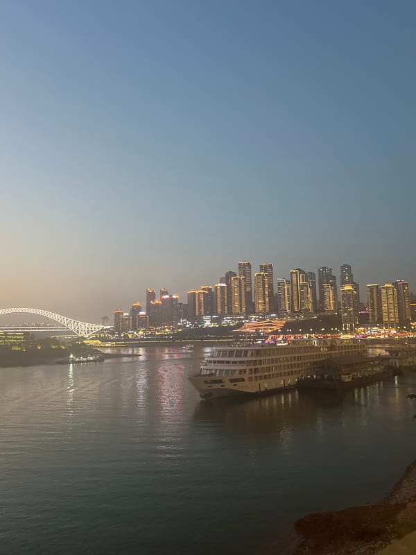 Chongqing's Yuzhong waterfront lights up at dusk