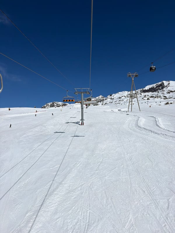 Skiers active on slopes at Huez resort, France