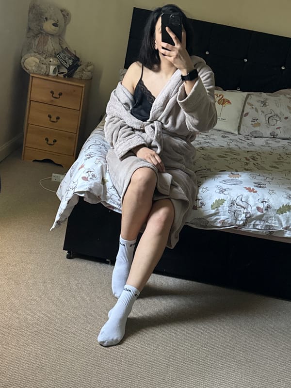 Woman photographs from bed in Great Yarmouth morning scene