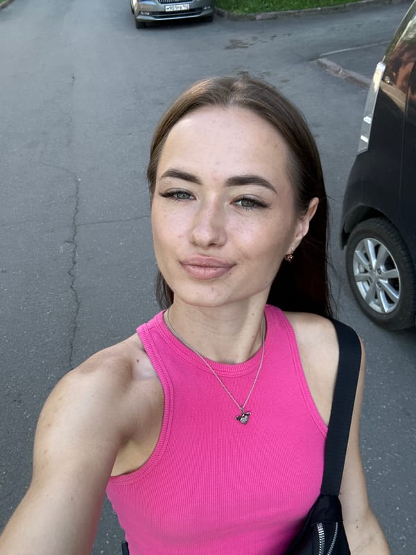 Sunny day selfies near blooming peonies and city buildings