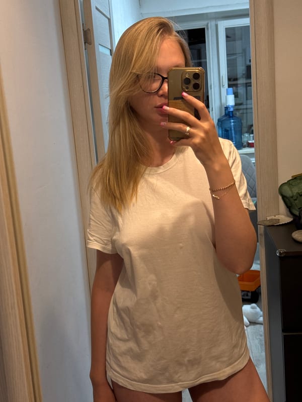 Woman takes mirror selfie in Chaikovsky, Russia