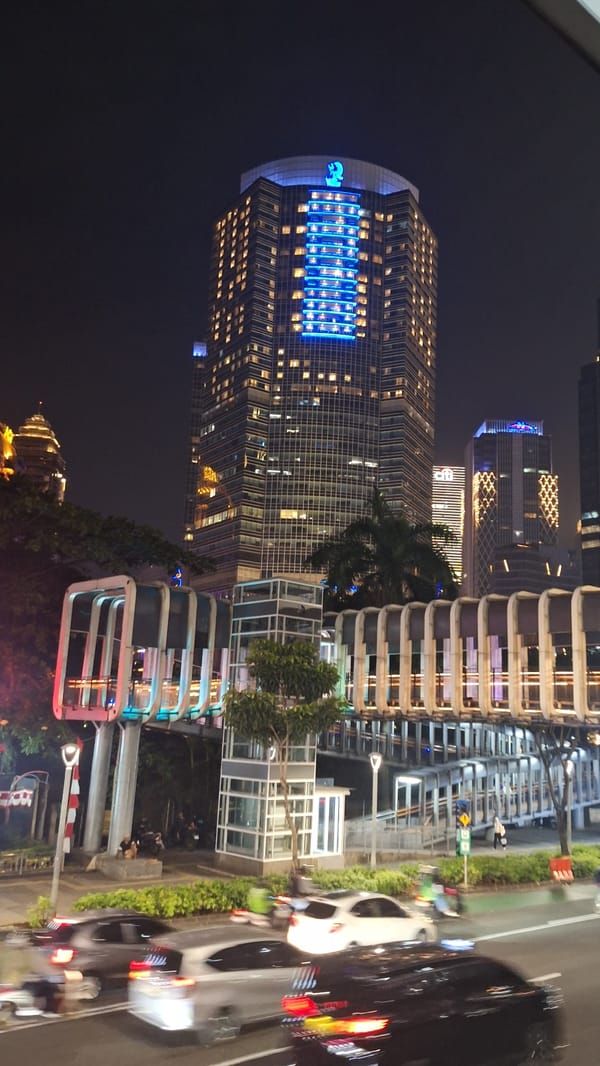 Nighttime festival with stages, displays documented in Central Jakarta