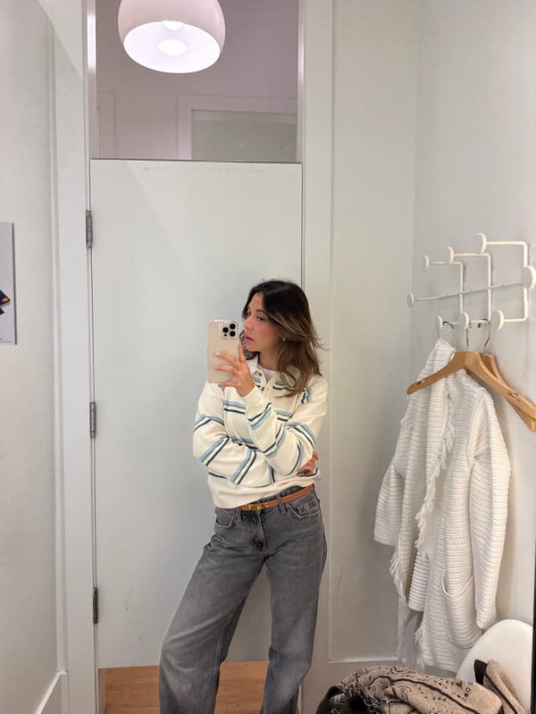 Woman documents shopping trip through multiple mirror selfies