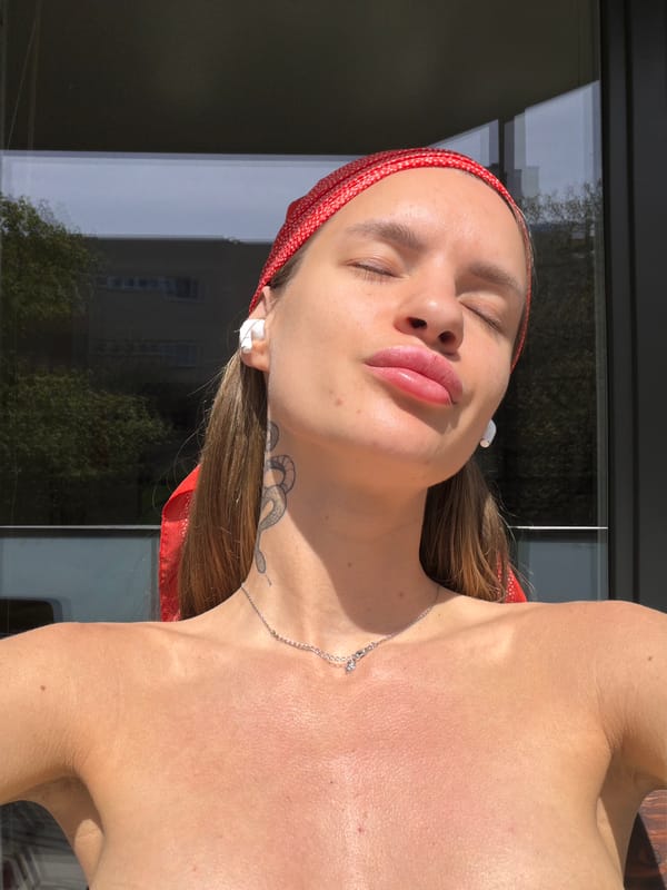 Woman enjoys sunny moment in Berlin with music