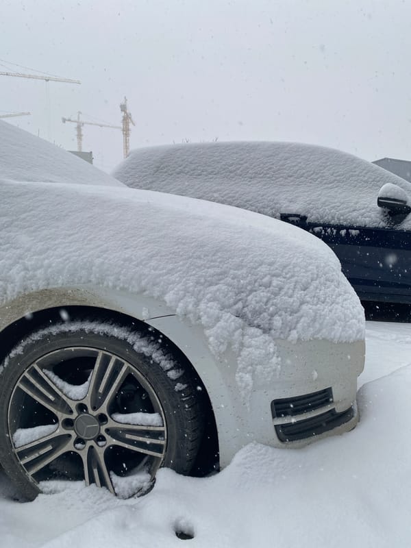 Heavy snow blankets parked cars on Yekaterinburg street