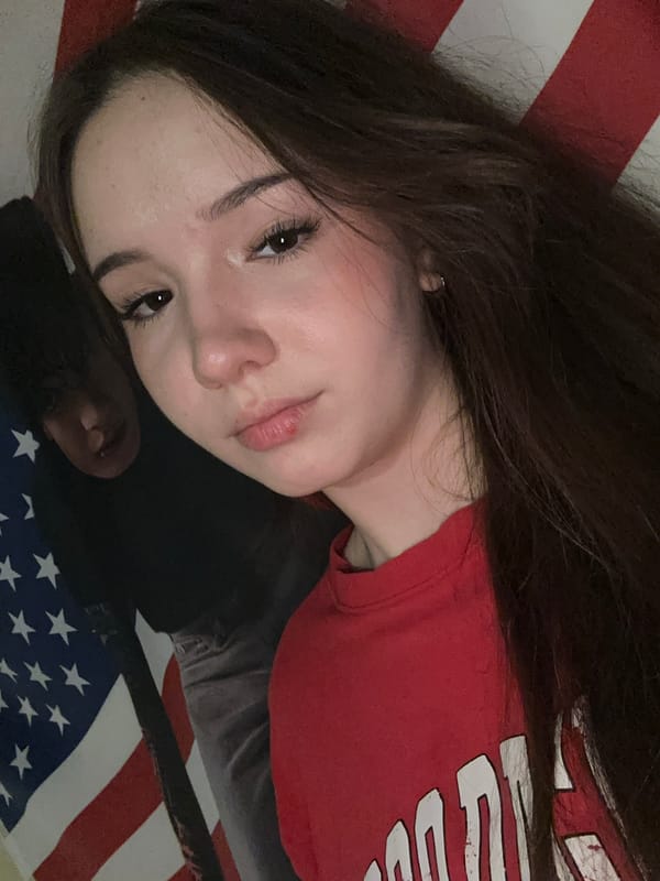 Woman takes selfies with American flag in Russian city