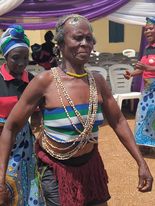 Traditional dance celebration with food service in Maigizo, Nigeria
