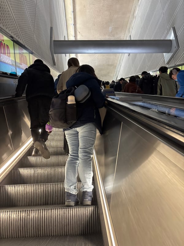 Commuters use escalator during morning hours in London