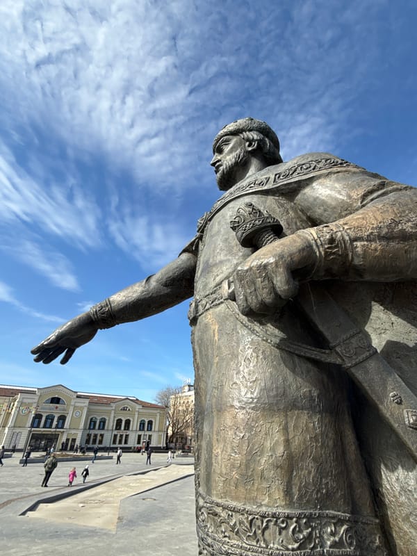 Tourists photograph historic Yuri Dolgoruky statue in Dmitrov