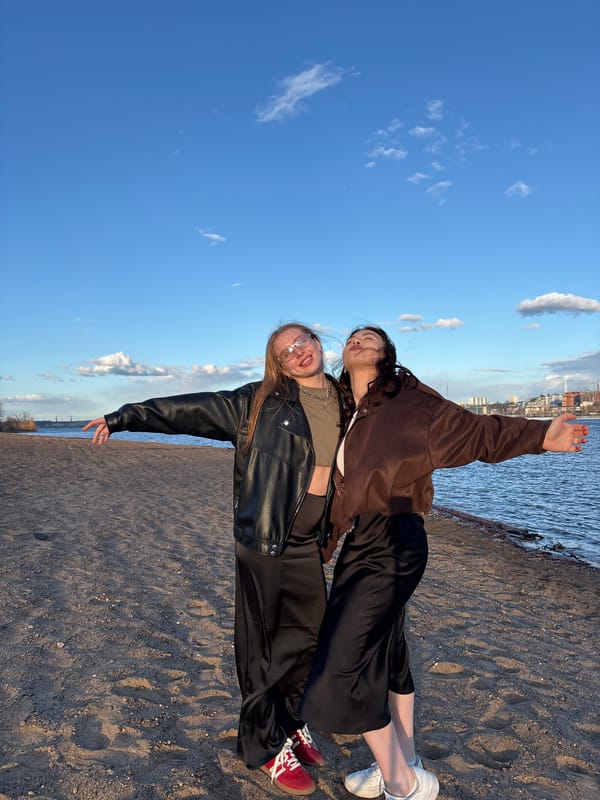 Young women pose for photos on Perm riverbank