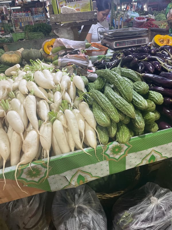 Fresh produce and active construction at a busy Davao morning