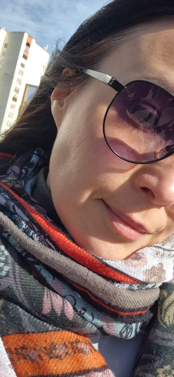 Person in patterned scarf photographed outdoors in Kazan