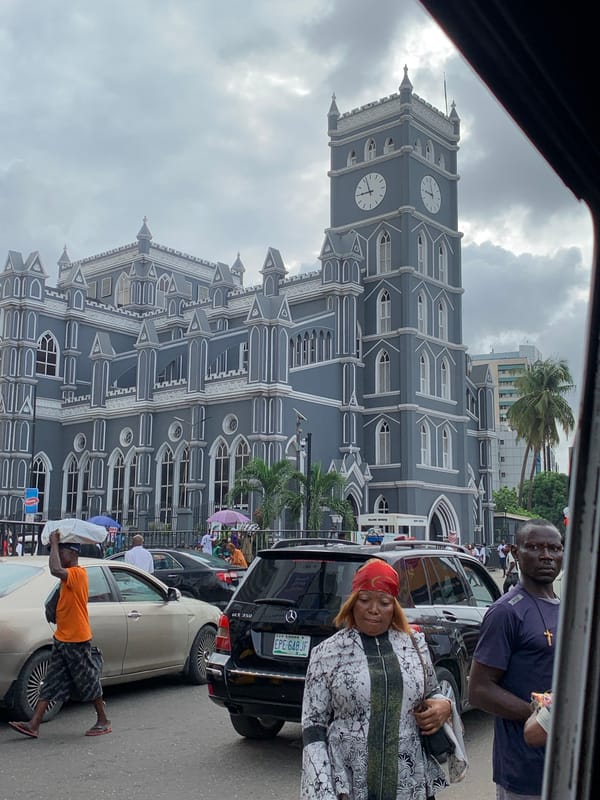 Morning street activity captured near Lagos cathedral